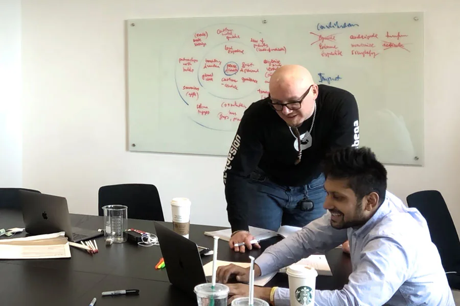Researching competitors online during an in-person brand strategy workshop